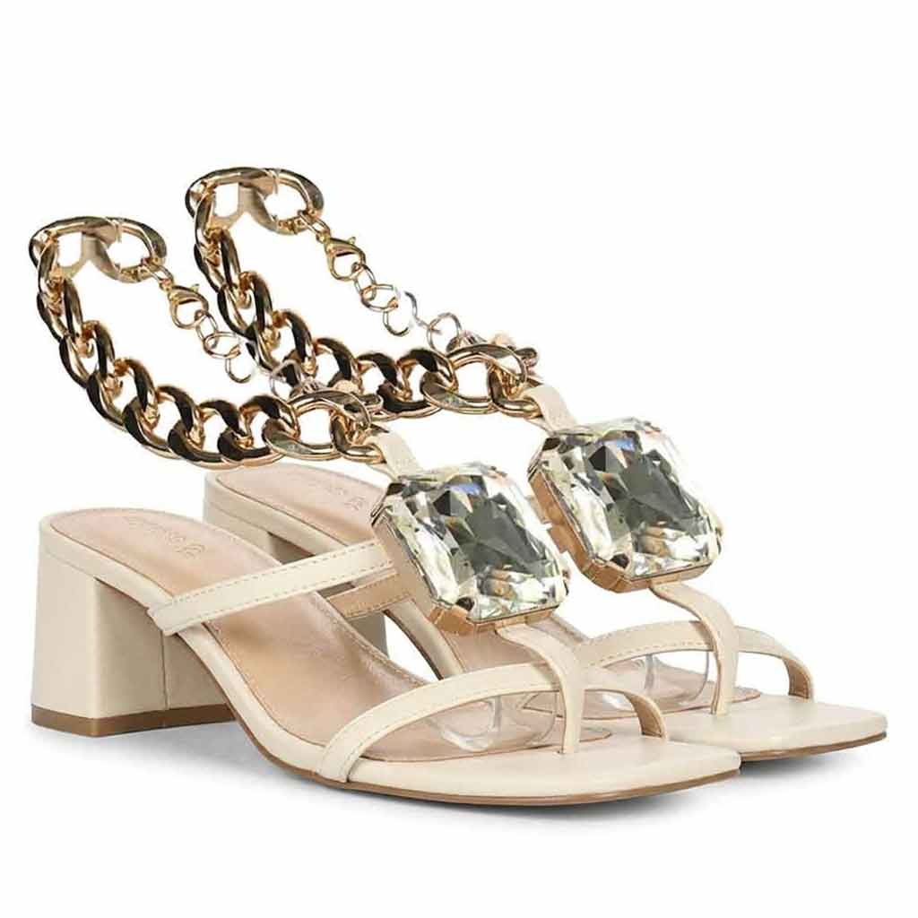 Low block heel shoes off white leather with crystal chain – angle view