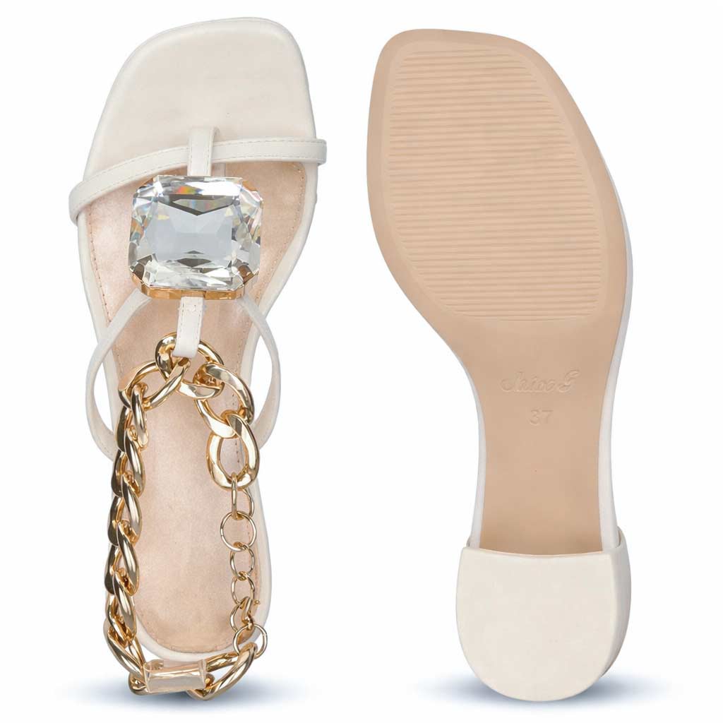 Low block heel shoes white leather crystal chain detail – close-up