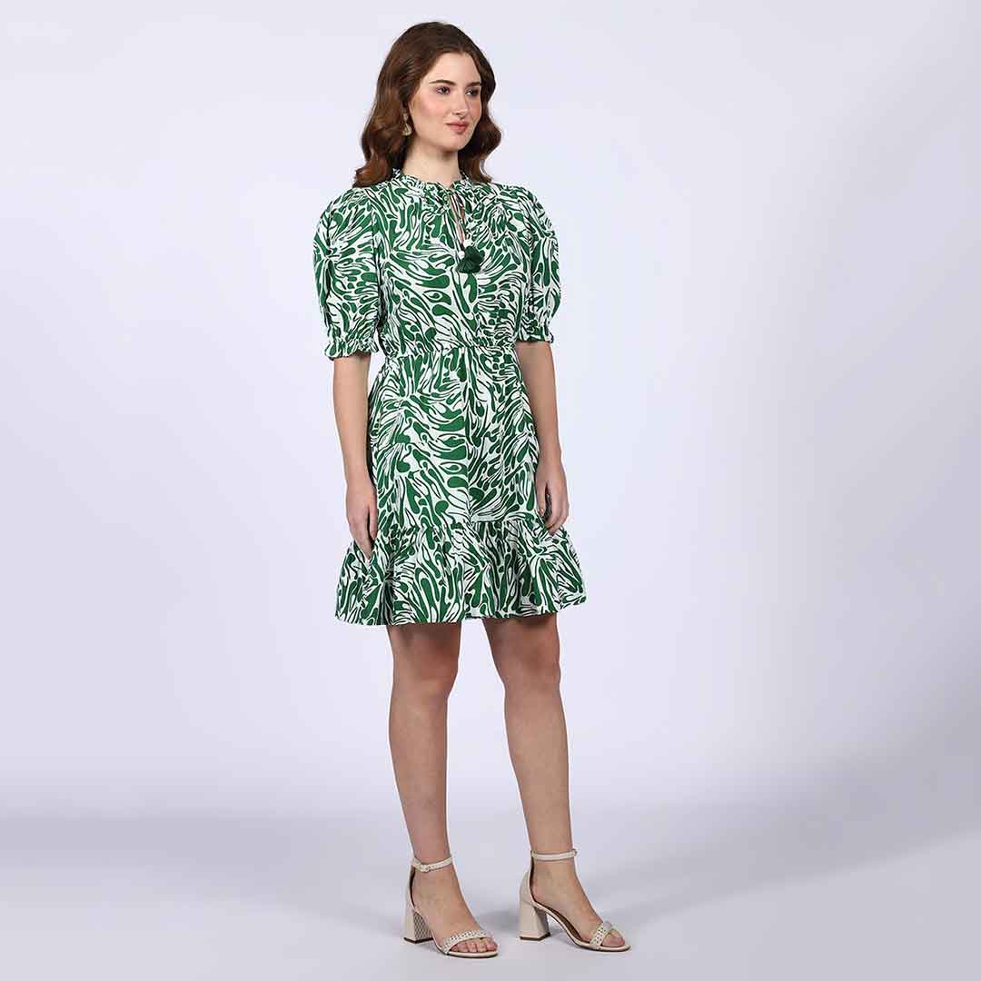 Saint green white leaf-print short dress for women UK, three-quarter front view.