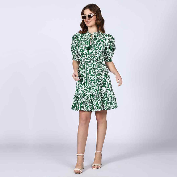 Saint green white leaf-print short dress for women UK, front view styled with sunglasses.