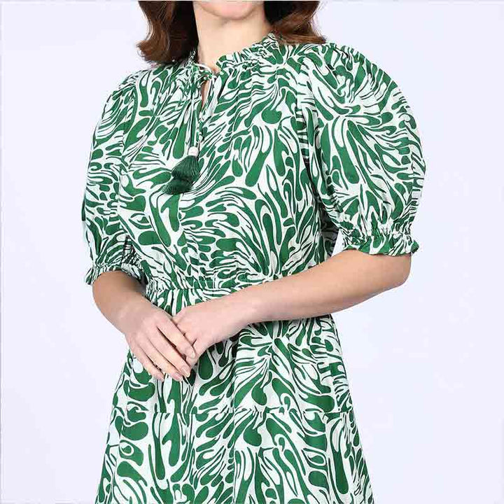 Close-up of tie neck on Saint green white leaf-print short dress for women UK.