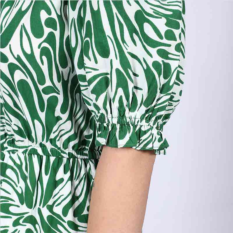Close-up of puff sleeve and leaf print on Saint green white short dress for women UK.