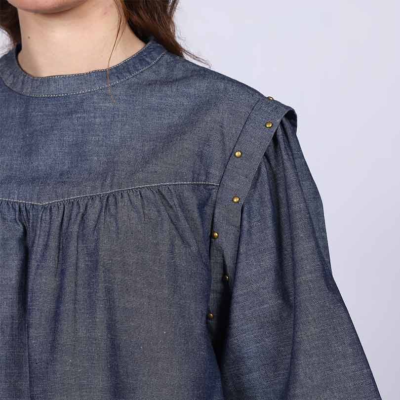 Close-up of snap-button shoulder placket on Saint grey cotton chambray top for women UK.