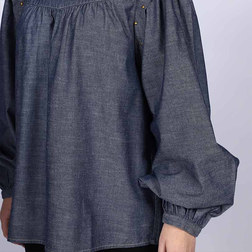 Close-up of gathered yoke and sleeve on Saint grey cotton chambray top for women UK.
