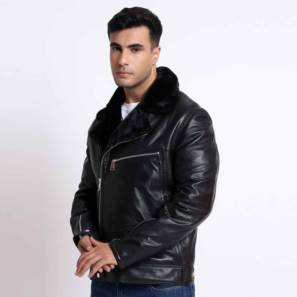 Side view of a man wearing a black leather biker jacket with a fur collar.