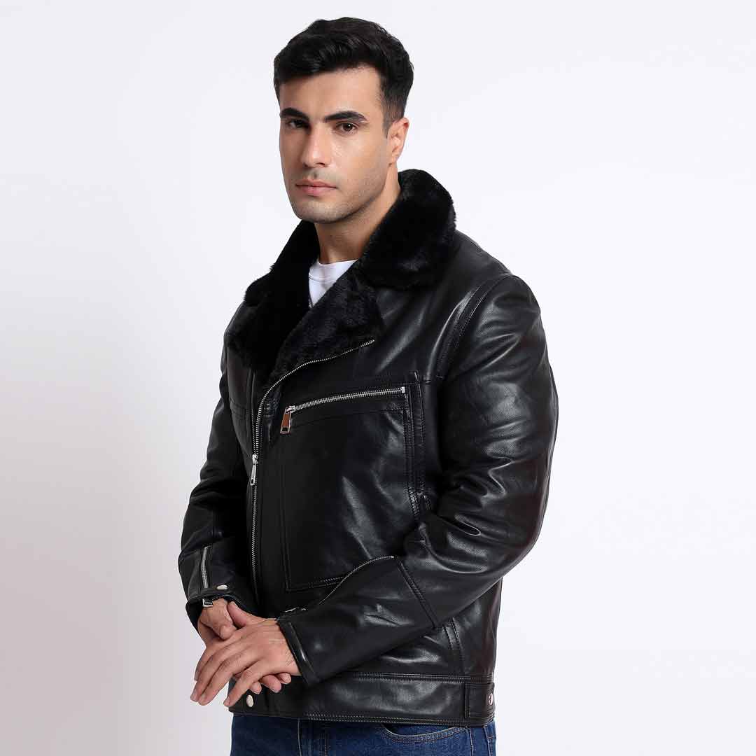 Side view of a man wearing a black leather biker jacket with a fur collar.