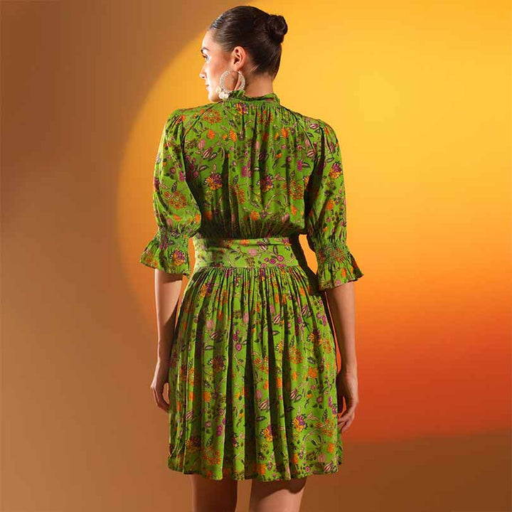Women's green floral short dress by Saint Hyralyn, back view showing banded waist.