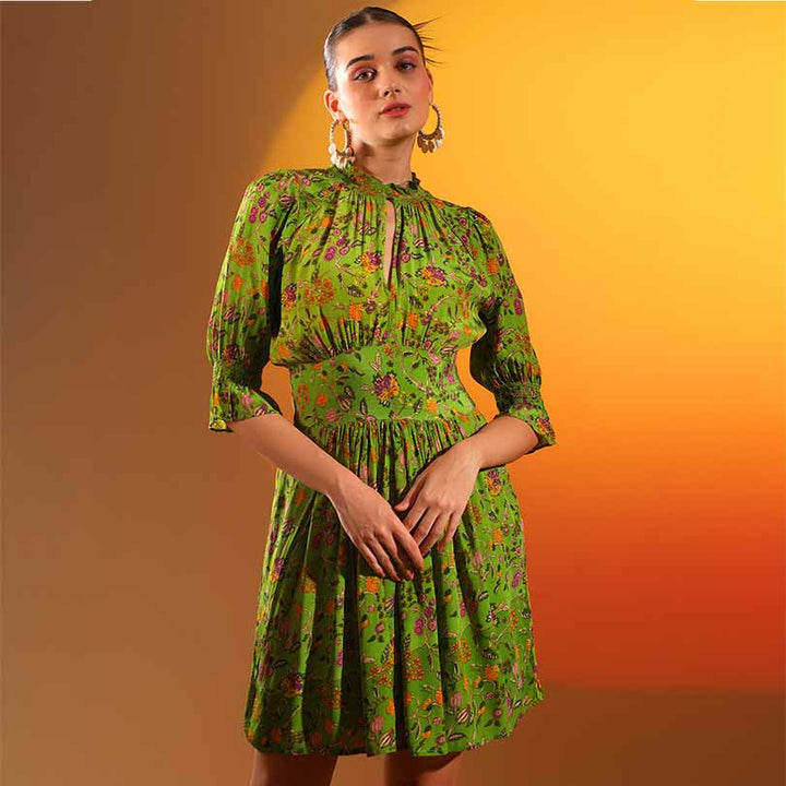 Women's green floral short dress by Saint Hyralyn, front view with ruffled sleeves.