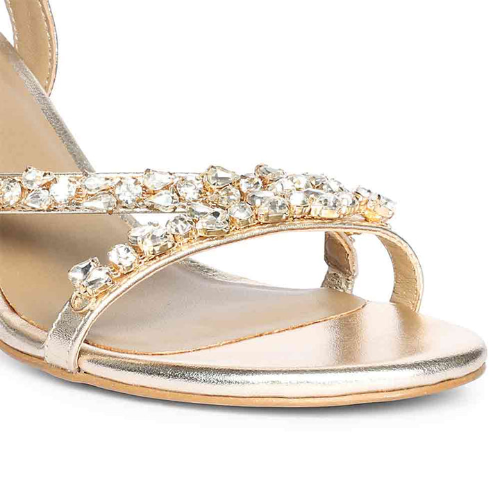 Close-up detail on Women's Saint Isla Stone Embellished Champagne Leather Strappy Stilettos