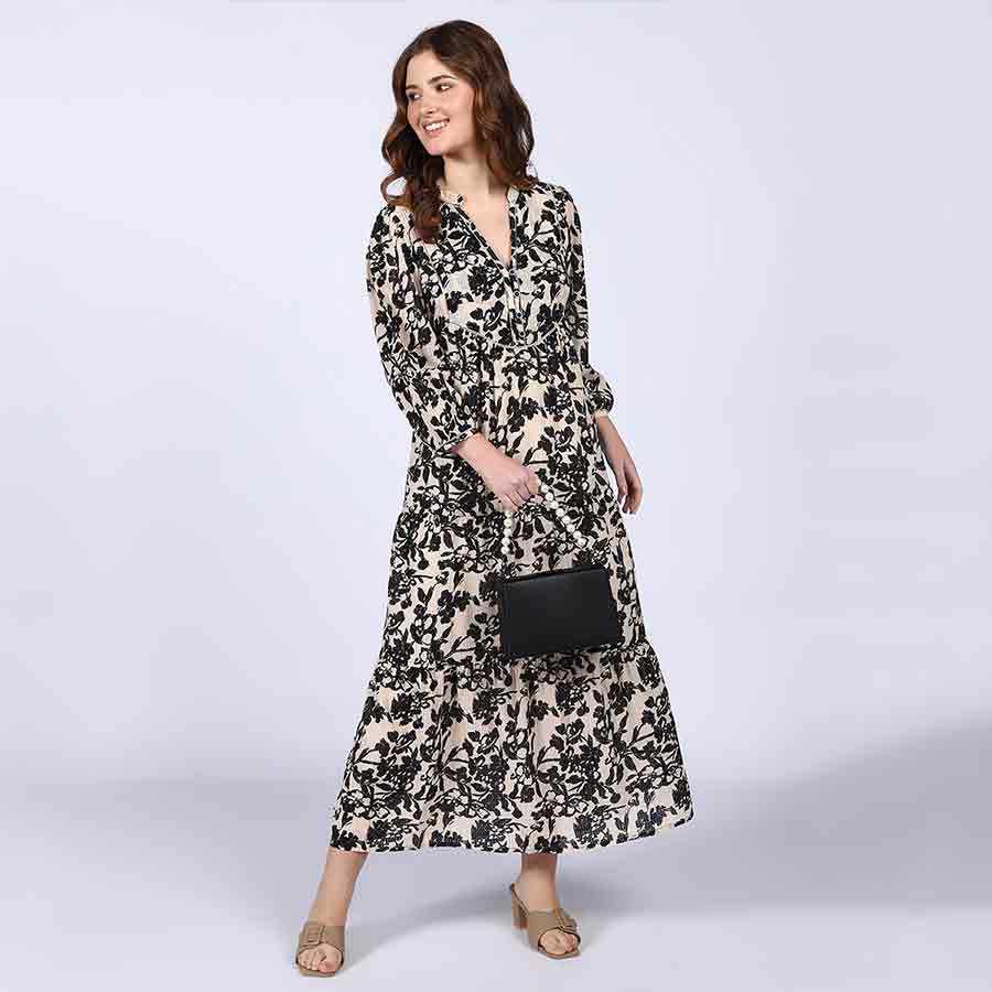 Saint ivory black floral viscose midi dress for women UK, front view styled with a clutch bag.