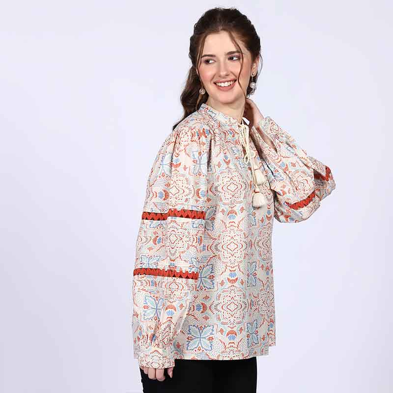Saint ivory multicolour block-print top for women UK, three-quarter front view showing zigzag sleeve trim.
