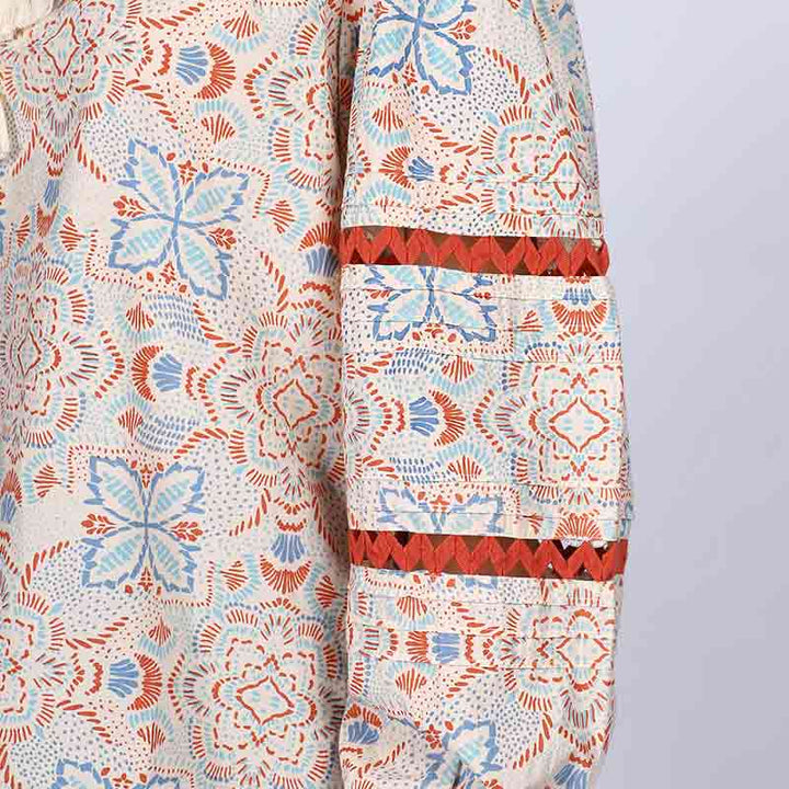 Close-up of zigzag trim and block print on Saint ivory multicolour top for women UK.