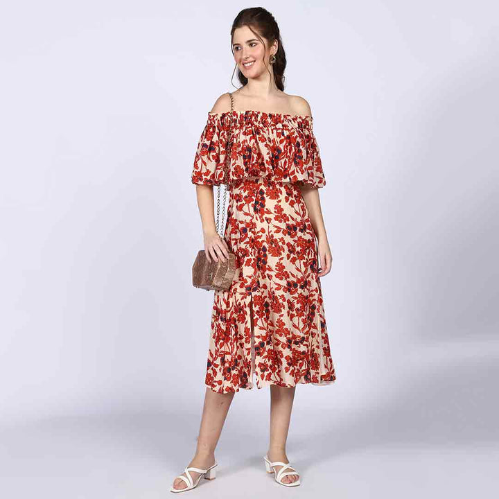 Saint ivory red off-shoulder midi dress for women UK, front view styled with a clutch bag.