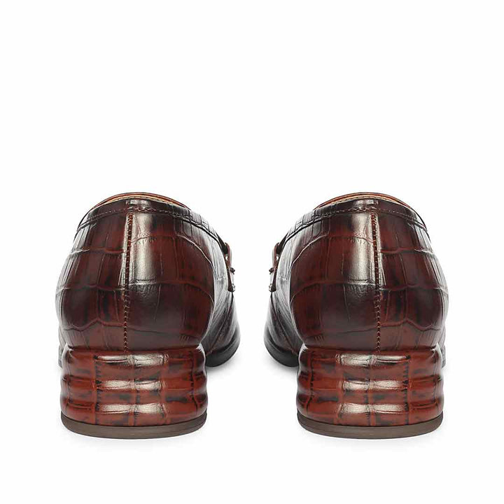 Ladies best croc-embossed chocolate leather moccasin detail, saddle and stitching close-up, UK