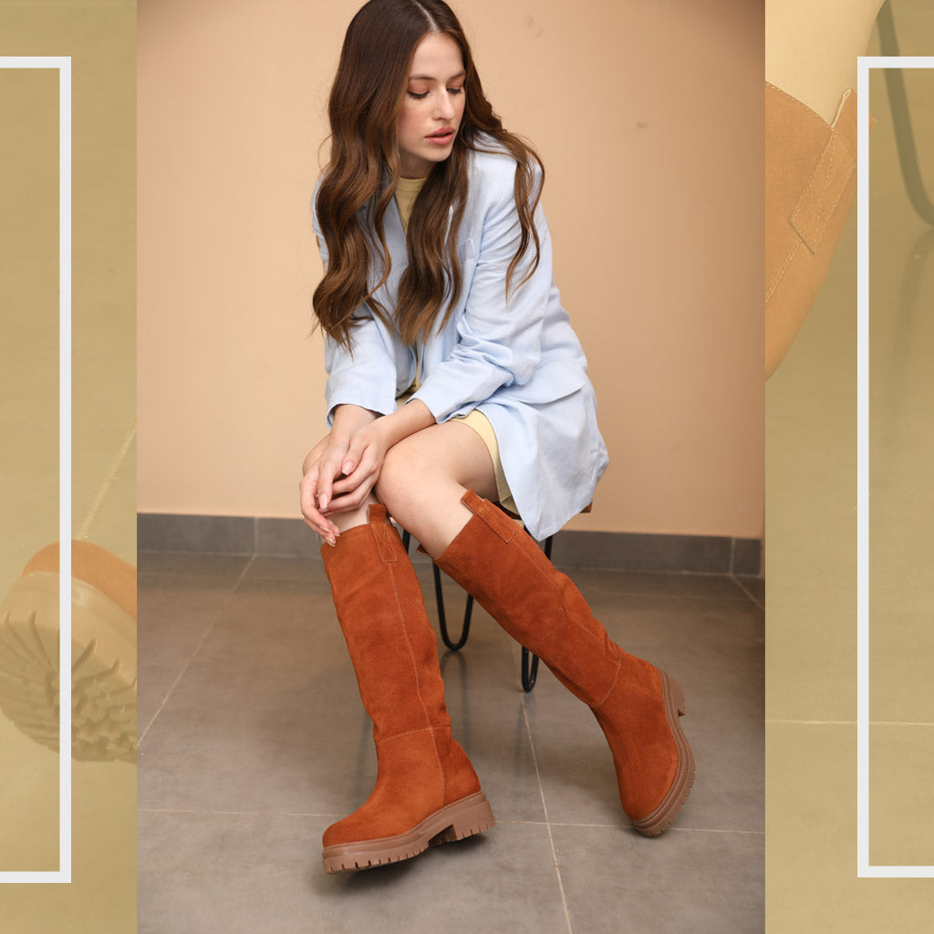 Women's suede knee high boots by Saint Janet, styled seated lifestyle shot