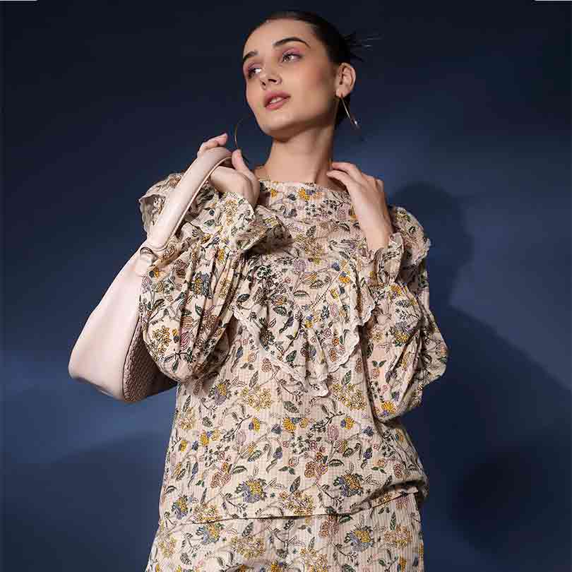 Saint Jasmaria ivory ruffle floral dobby top for women UK, front view styled with a shoulder bag.