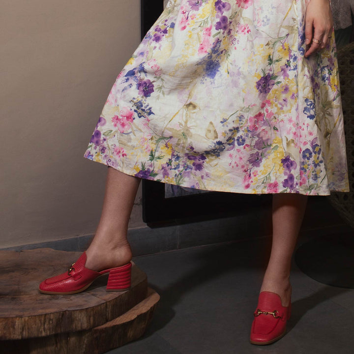 Ladies red lizard-embossed leather mules, styled lifestyle shot, UK