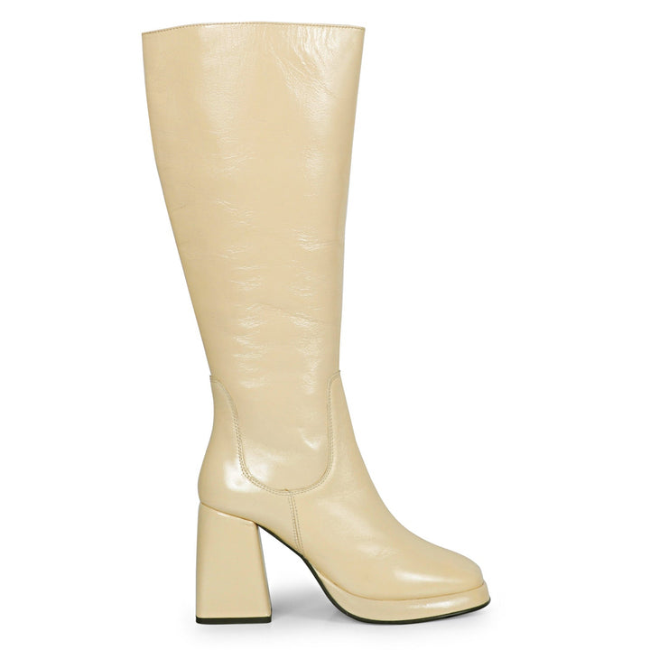 Saint Jolene off white patent leather knee high boots for women, side view of flared block heel