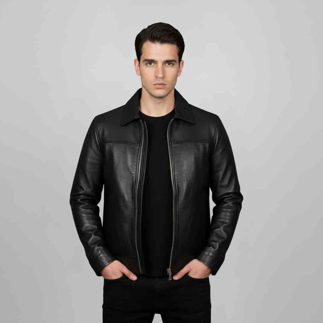 Man wearing an open black leather jacket with a shirt collar.