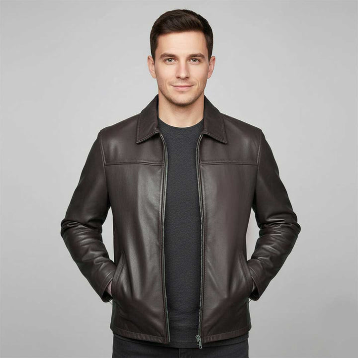Man wearing an open chocolate brown leather jacket.