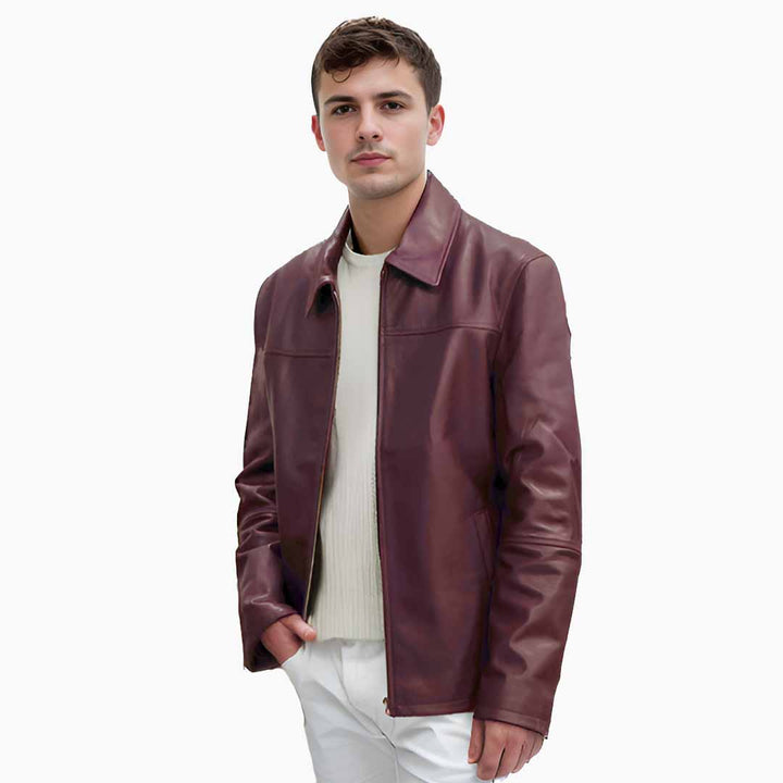 Man wearing an open maroon leather jacket with a shirt collar.