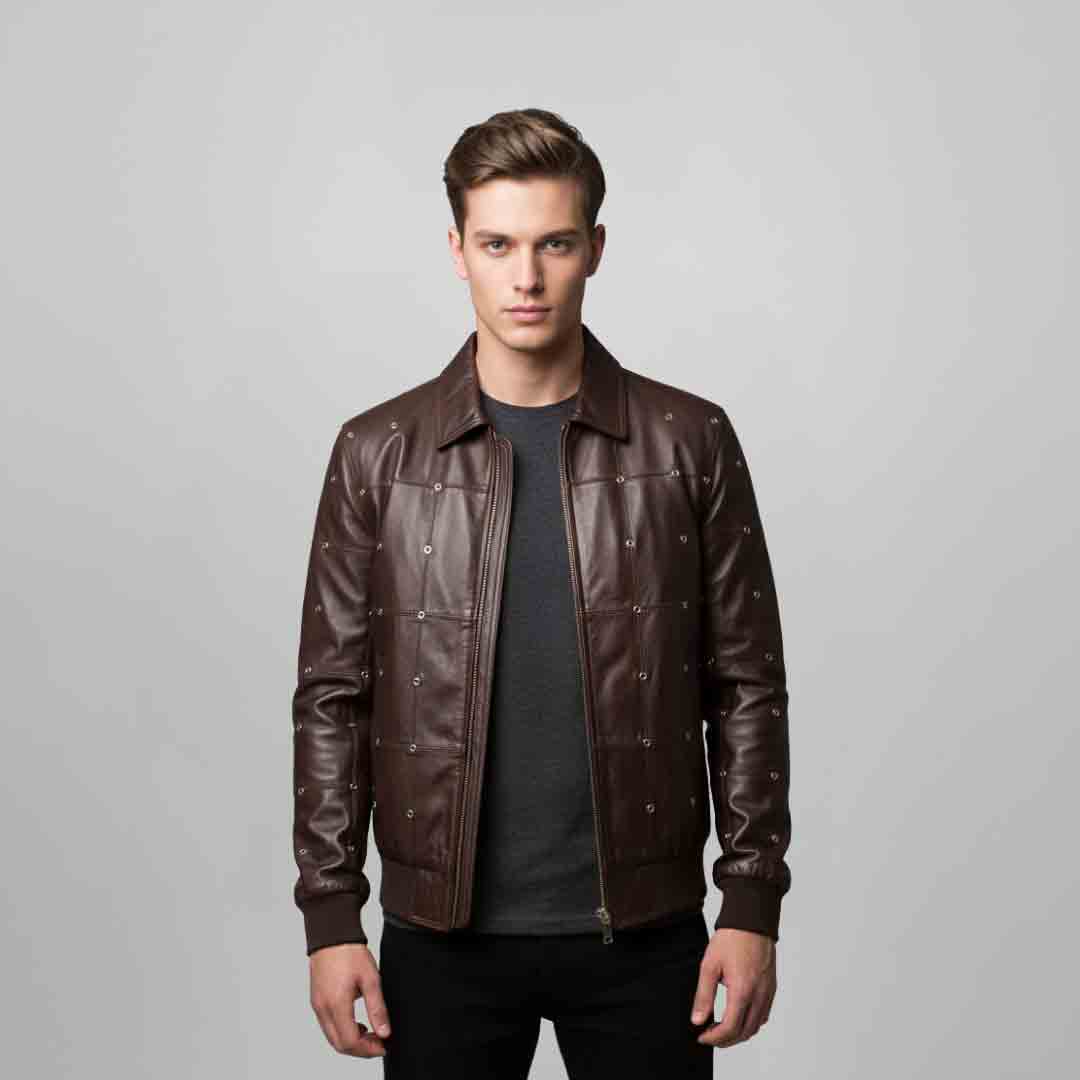Man wearing an open brown leather bomber jacket with dome-stud detailing, front view.