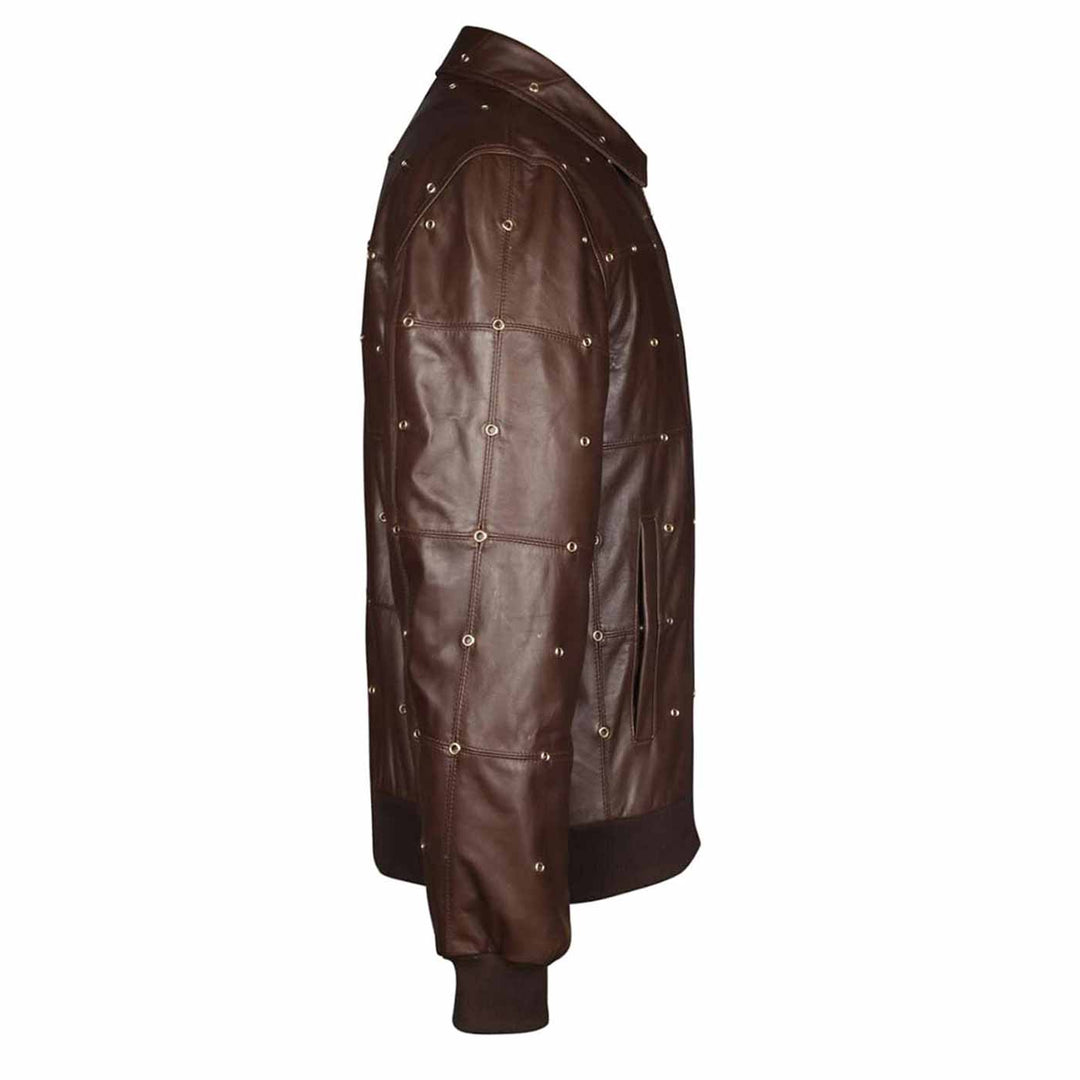Close-up side view of a brown leather bomber jacket's stud detailing.