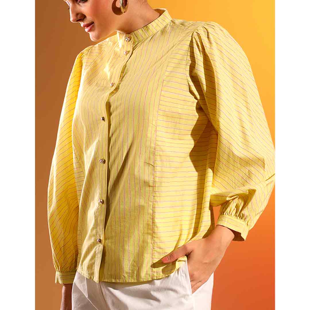 Close-up of puff sleeve and button placket on Saint Kaeloryn amber stripe cotton shirt for women UK.