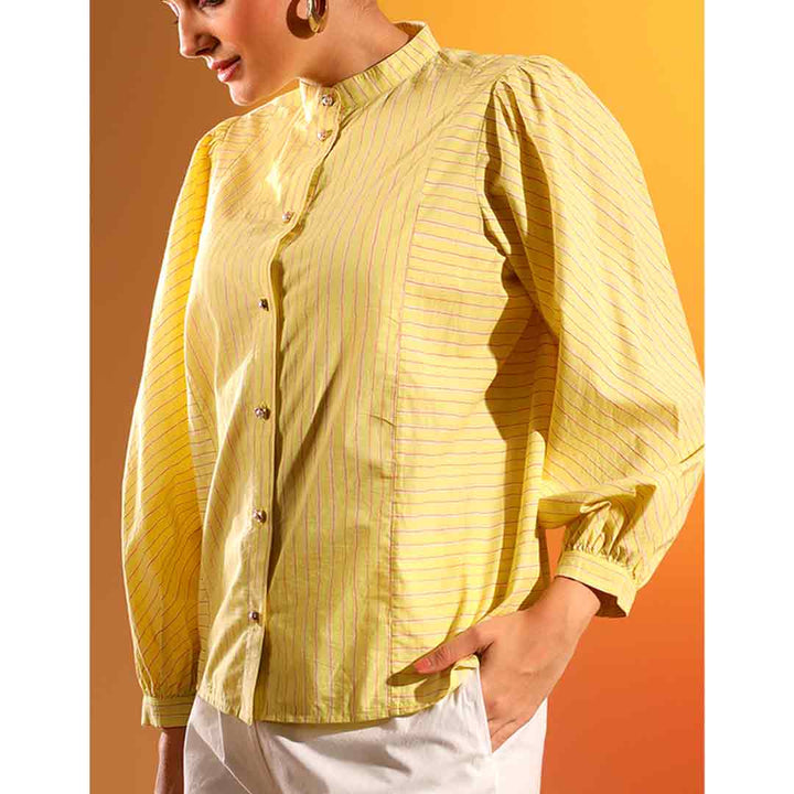 Close-up of puff sleeve and button placket on Saint Kaeloryn amber stripe cotton shirt for women UK.