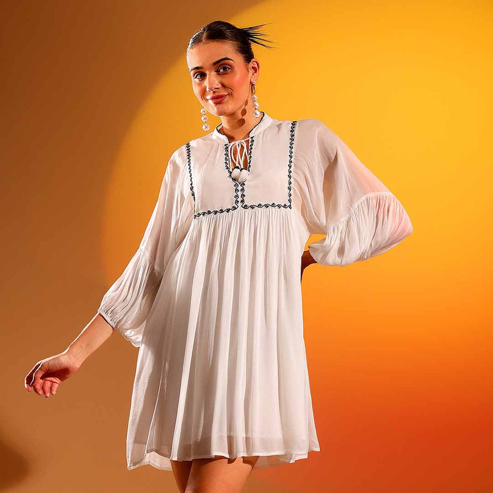 Women's white viscose crepe dress by Saint Kay, front view with balloon sleeves.
