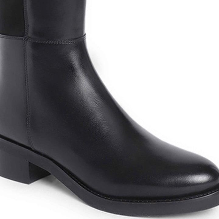 Close-up of ankle and heel on Saint Kayleigh black leather above the knee boots UK