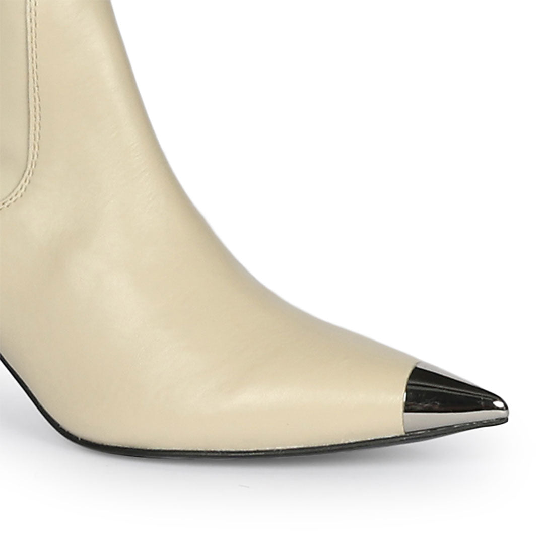Close-up of metallic toe cap on Saint Laurine beige above the knee boots UK