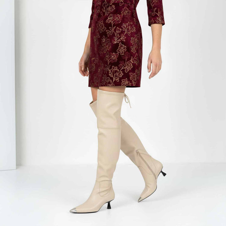 Women's beige above the knee boots UK by Saint Laurine, styled walking lifestyle shot