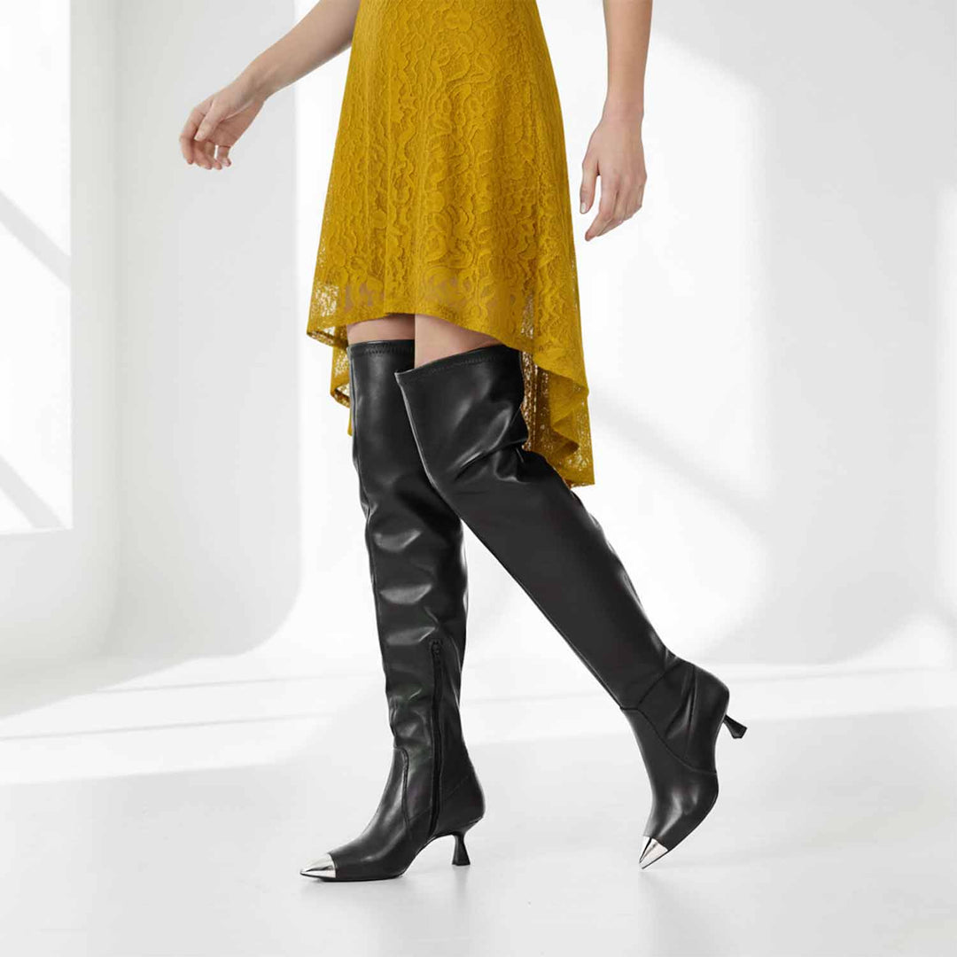 Women's black above the knee boots UK by Saint Laurine, styled walking lifestyle shot