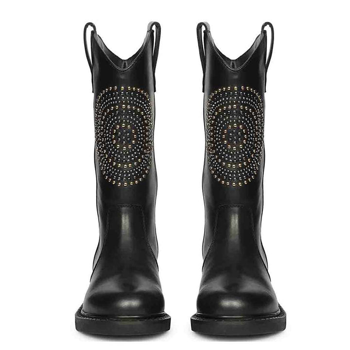 Saint Lilah studded black leather boots, front pair view showing pull tabs and stud medallion