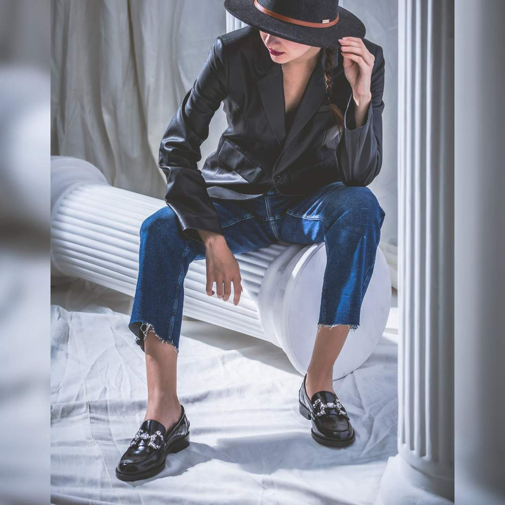 Ladies black leather crystal loafer moccasins, styled lifestyle shot, UK