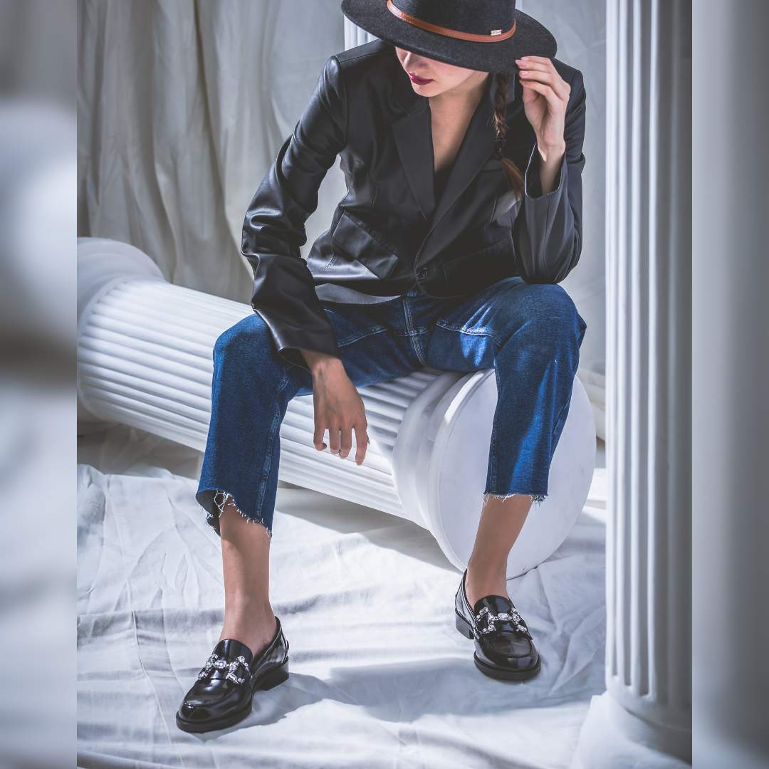 Ladies black leather crystal loafer moccasins, styled lifestyle shot, UK