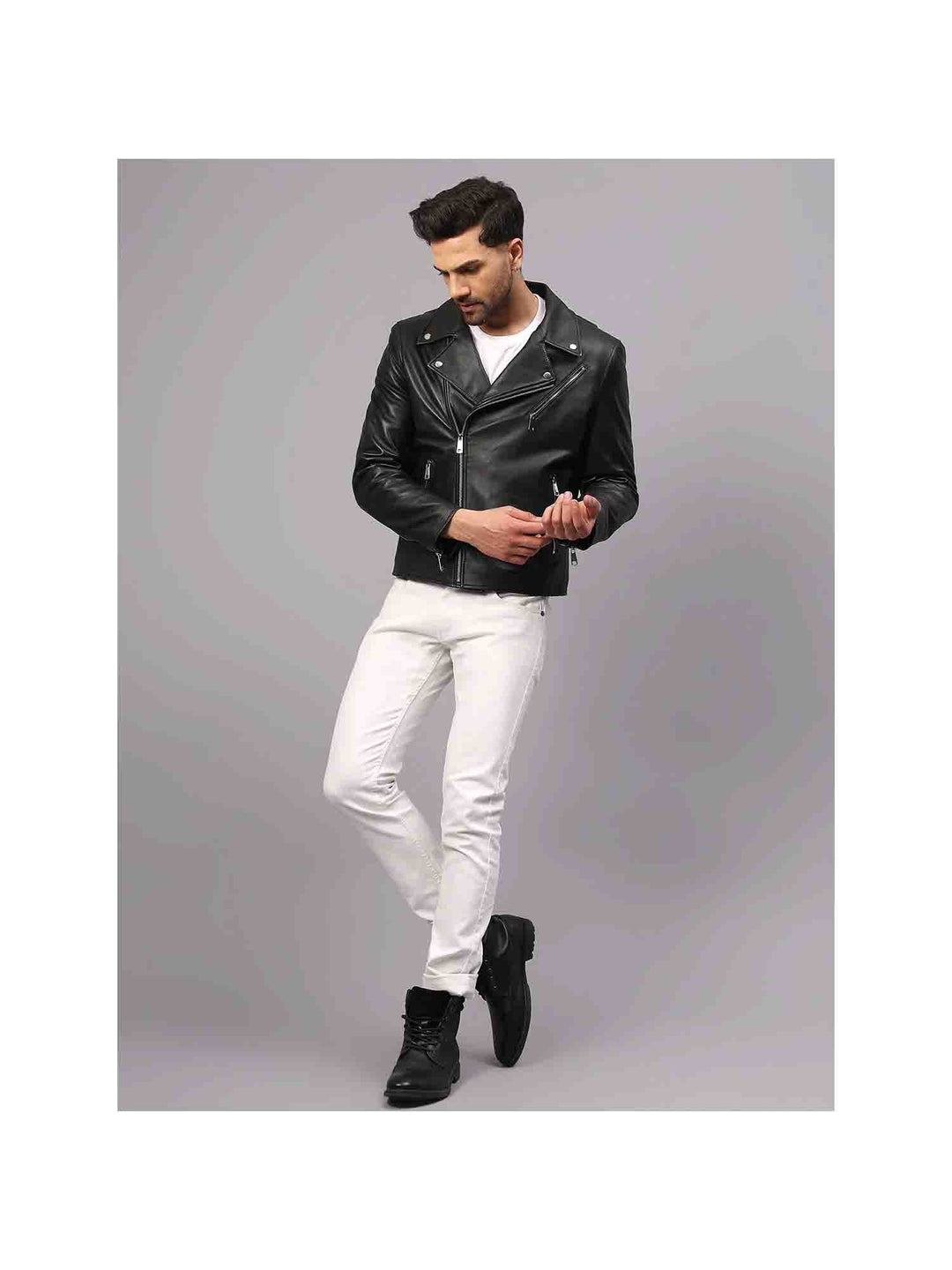 Full-length shot of a man wearing a black leather biker-style jacket.