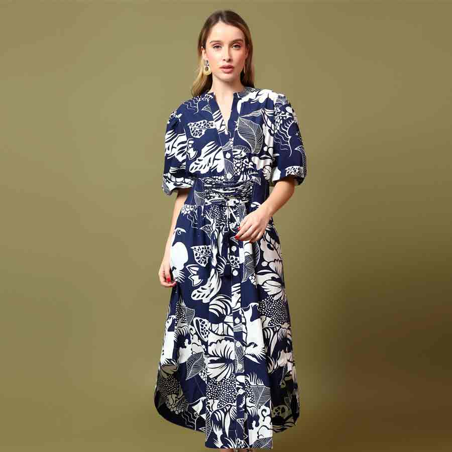 Saint Louise navy white botanical print midi dress for women UK, front view styled with a handbag.