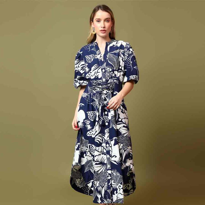 Saint Louise navy white botanical print midi dress for women UK, front view styled with a handbag.