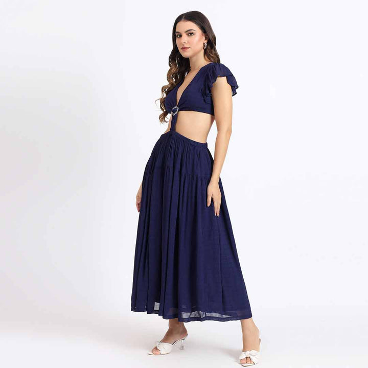 Full-length shot of a woman wearing a navy blue maxi dress.