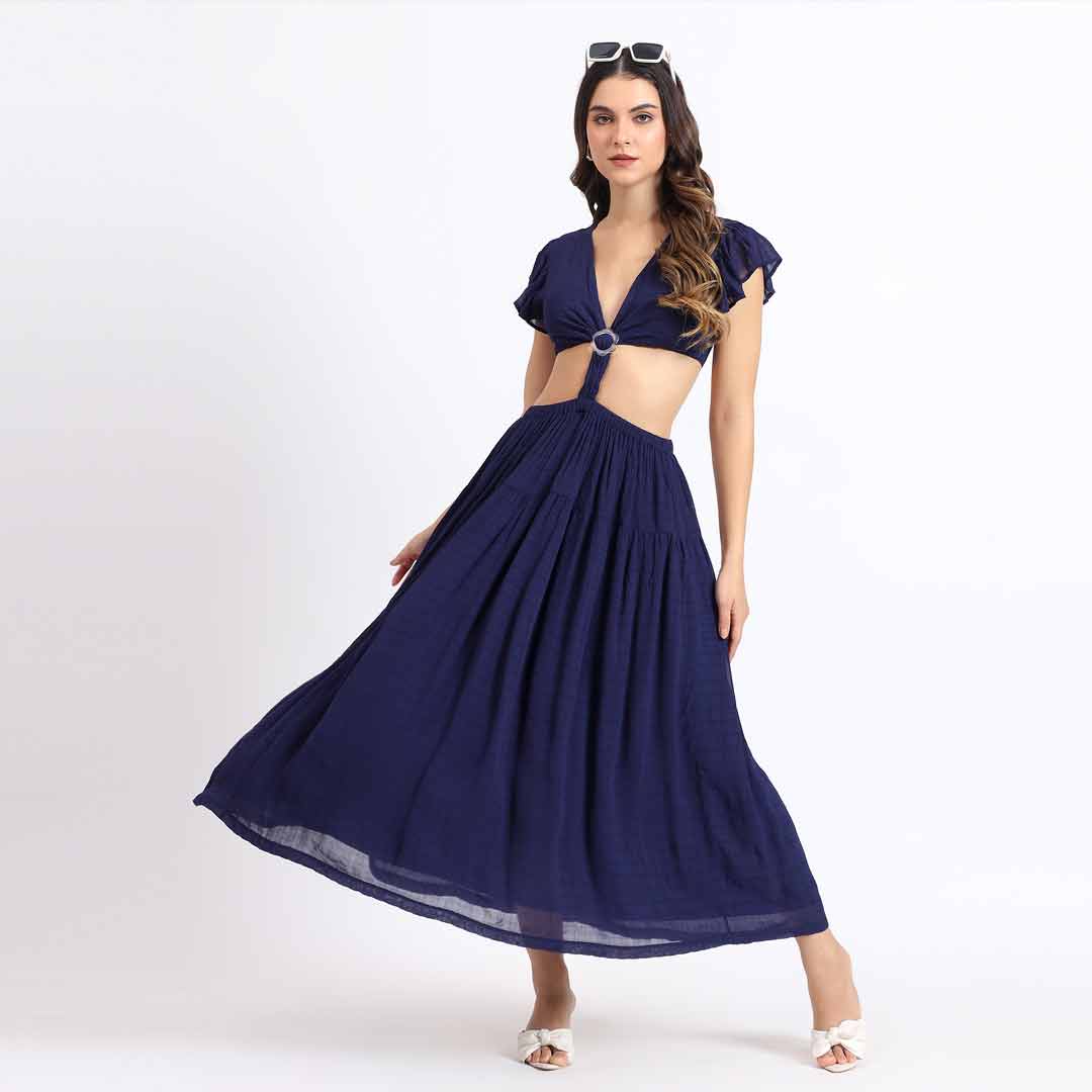 Side view of a woman wearing a navy blue long dress.