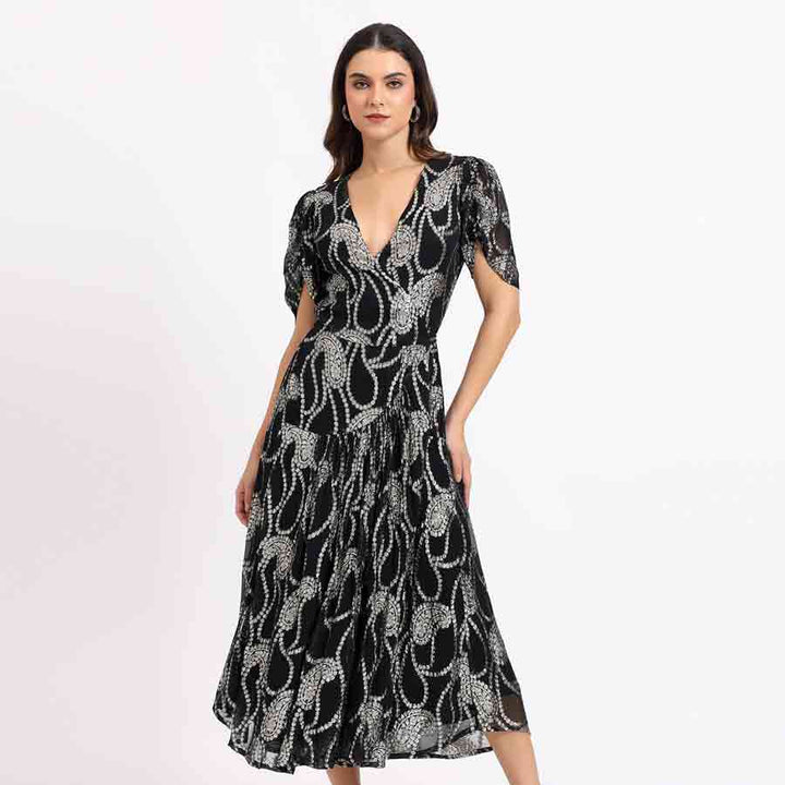Saint Maisie black ivory paisley tea-length dress for women UK, front view with V-neck and tiered hem.