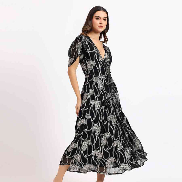 Saint Maisie black ivory paisley tea-length dress for women UK, side view showing lower-calf hem.