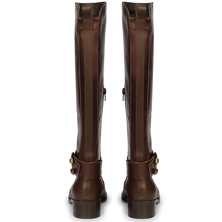 Women's brown leather knee high boots, back pair view showing gold buckle straps