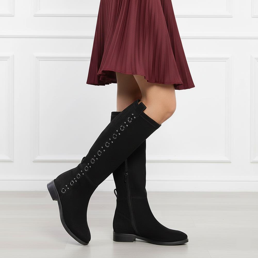 Women's Saint Marlowe black suede long boots styled with a pleated maroon skirt, lifestyle view