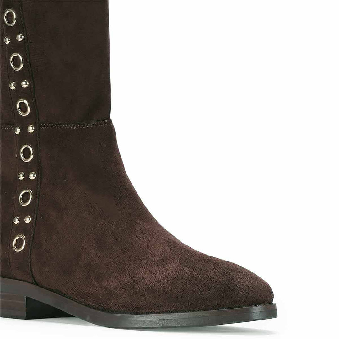 Close-up of eyelet trim on Saint Marlowe brown stretch suede long boots