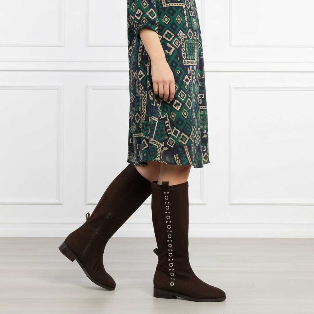 Women's Saint Marlowe brown suede long boots styled with a printed midi dress, lifestyle view