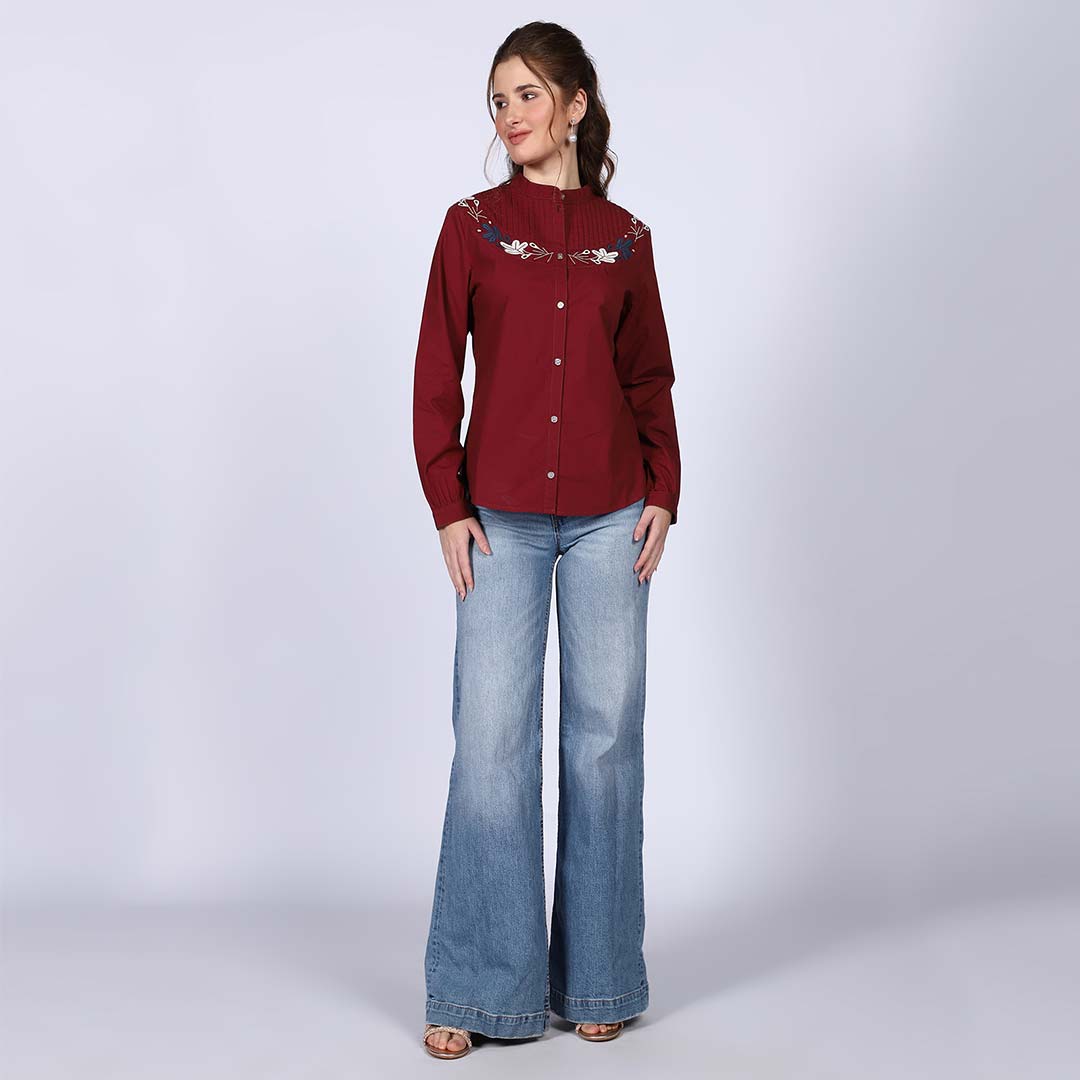 Saint maroon embroidered pintuck-yoke top for women UK, front view styled with wide-leg jeans.