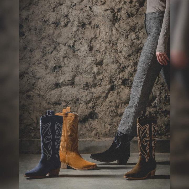 Women's denim suede cowboy boots by Saint Martina, styled group shot with tan and black colourways